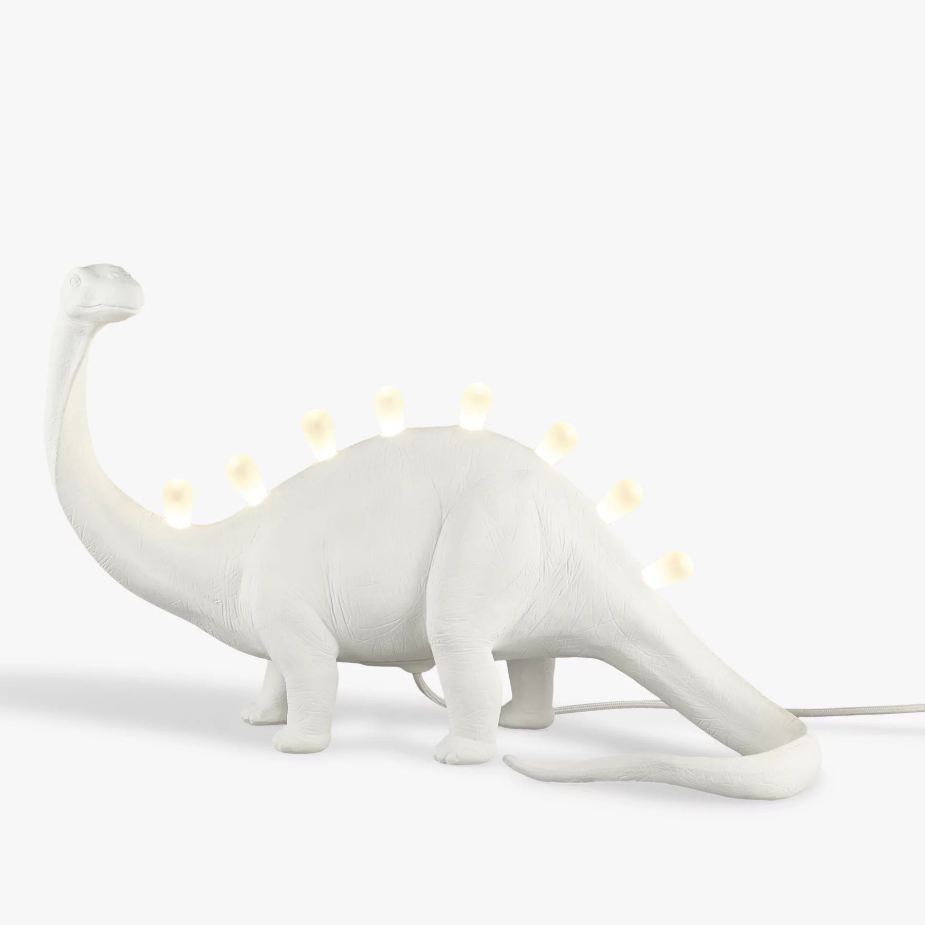 DinoLite™ Tischlampe – Kreative Design-Lampe mit beleuchtetem Dinosaurier-Rücken