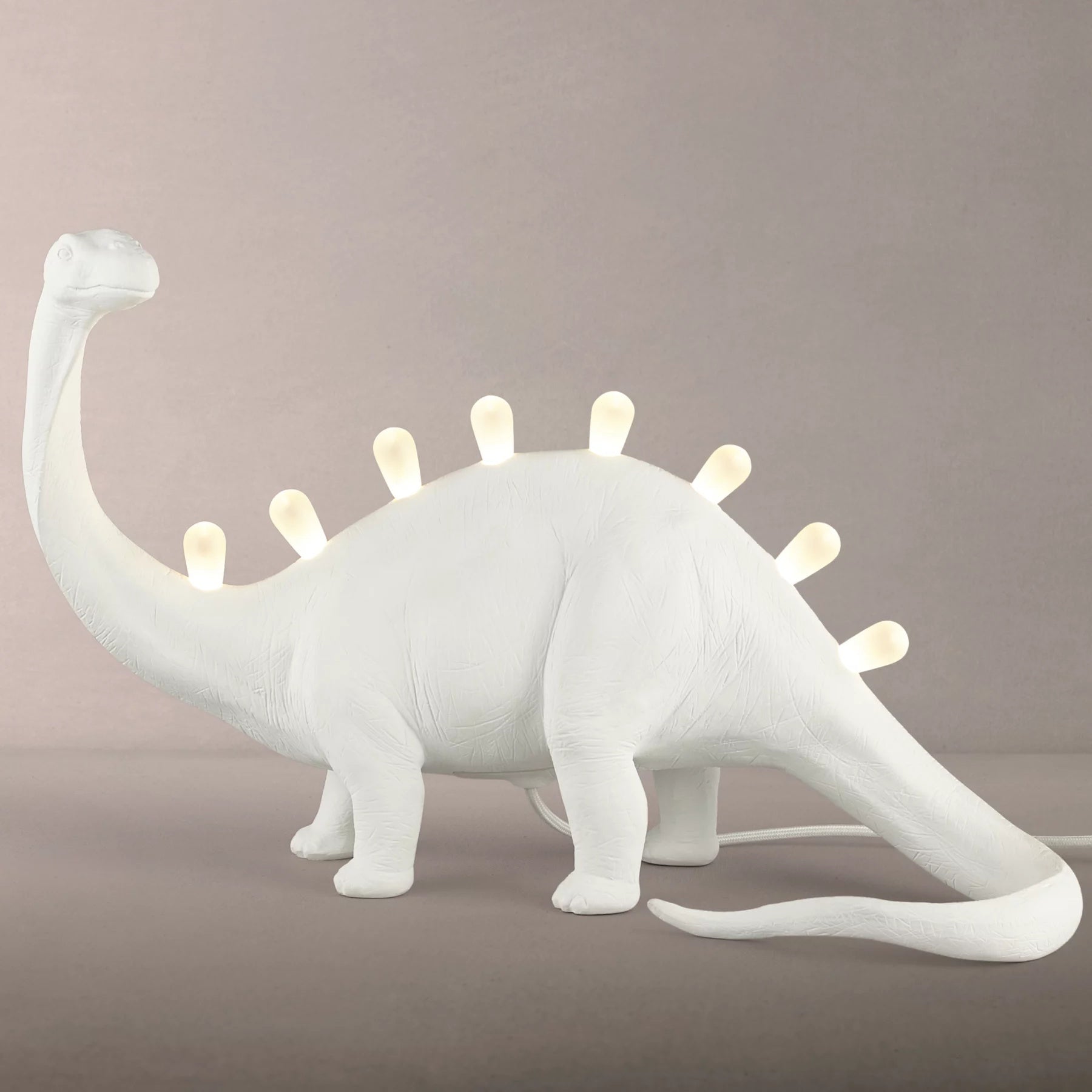 DinoLite™ Tischlampe – Kreative Design-Lampe mit beleuchtetem Dinosaurier-Rücken